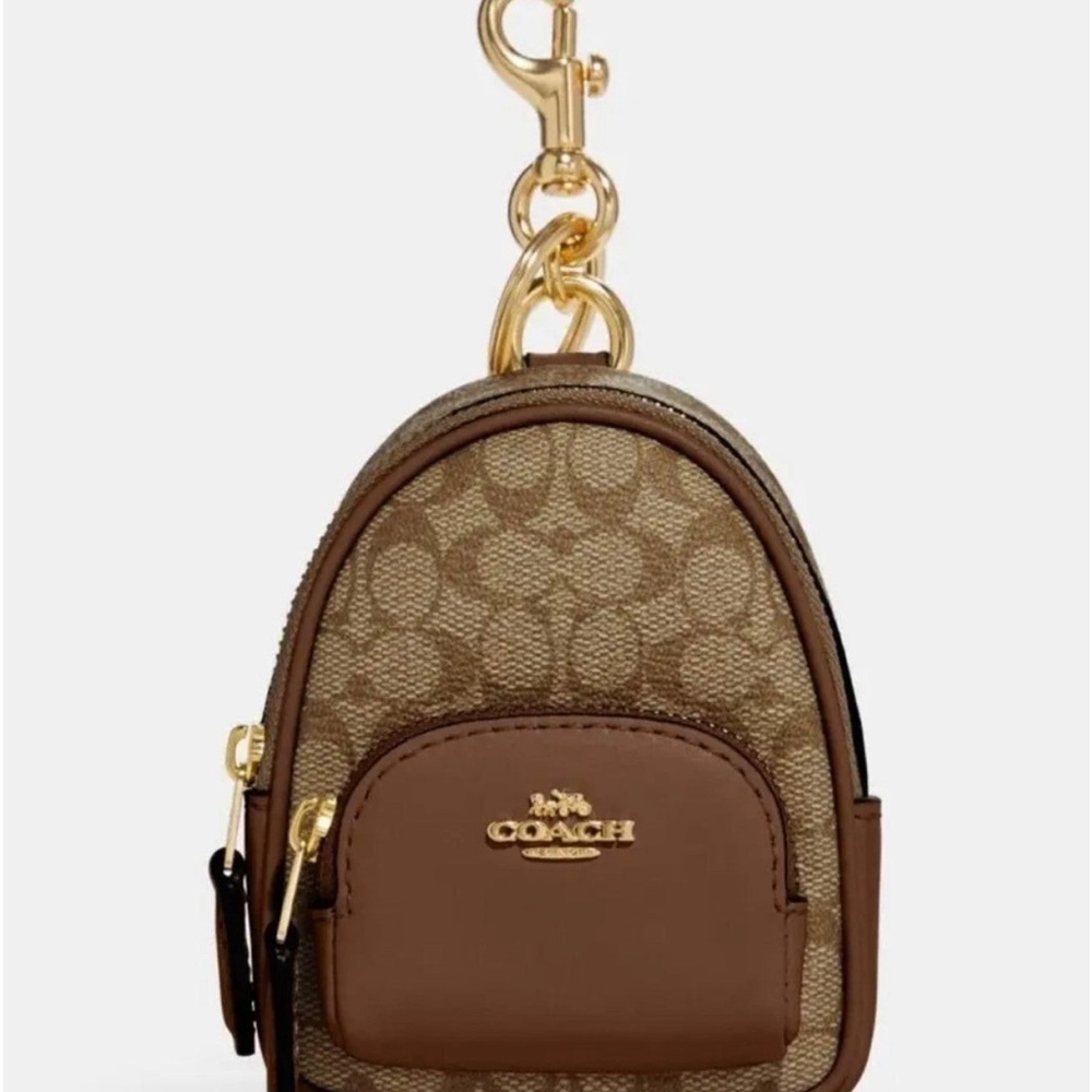 100% Authenti‹ Coach mini backpack charm Brand new with tag. Brown Beige.